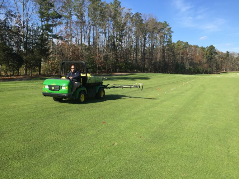 Spraying a fairway as part of a Mirimichi Green soil health program